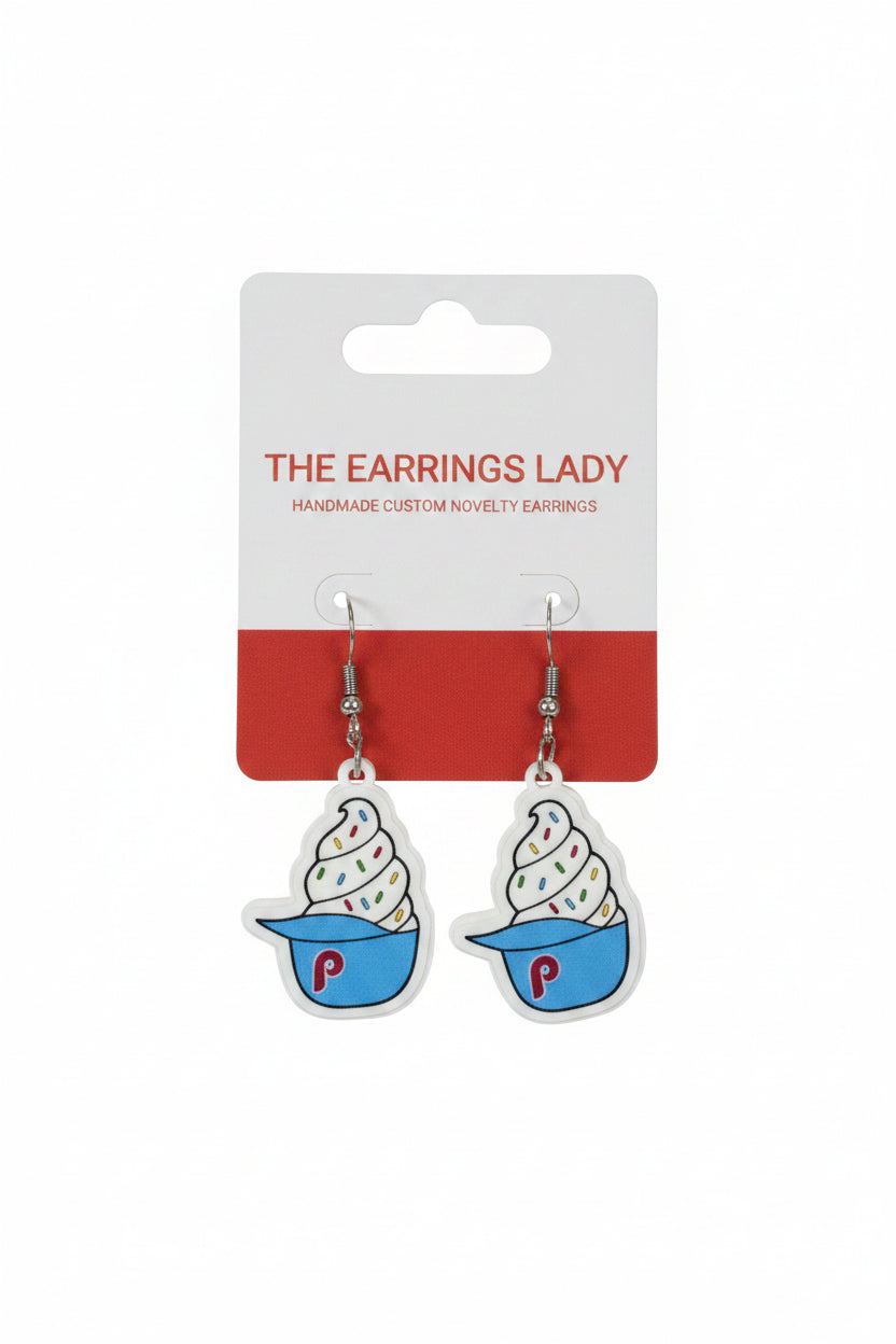 Ice cream cone earrings on a 'The Earrings Lady' card against a carpeted background