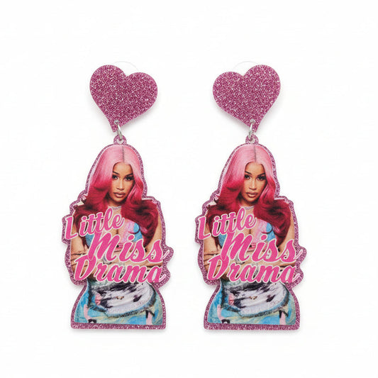 Earrings with a Cardi B and 'Little Miss Drama' text on a dark background
