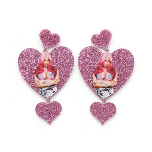 Heart-shaped earrings with a Cardi Bwith pink hair 