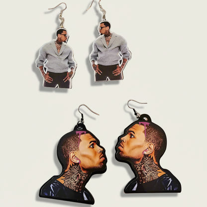 Two pairs of earrings with images of a person on a light gray background
