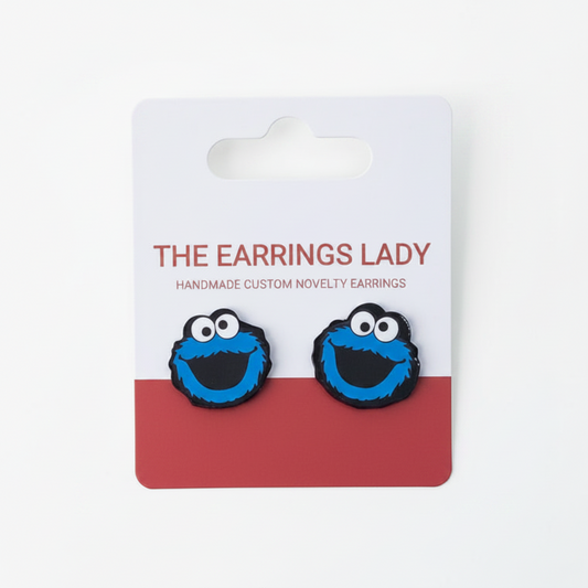 Cookie Monster earrings on a branded card with 'The Earrings Lady' branding.