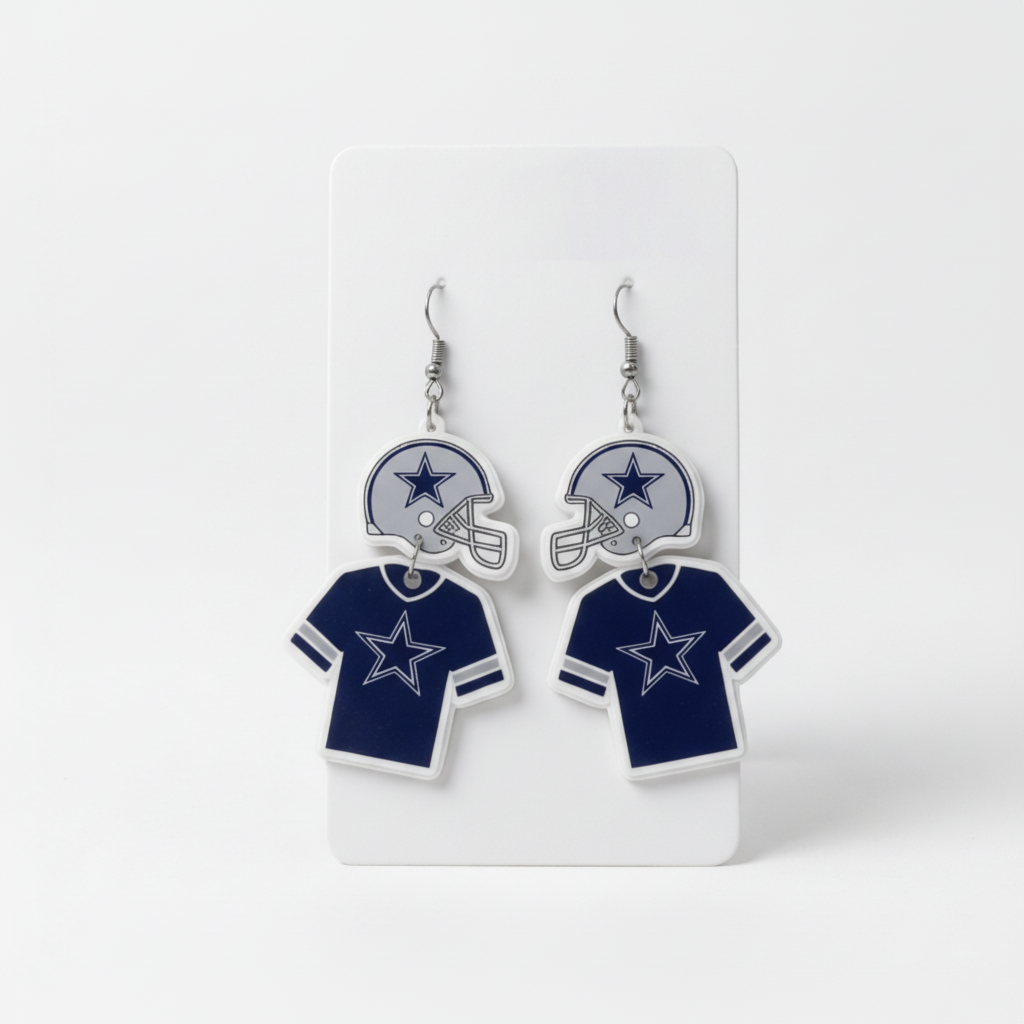 Dallas Cowboys-themed earrings on a white card with a white background