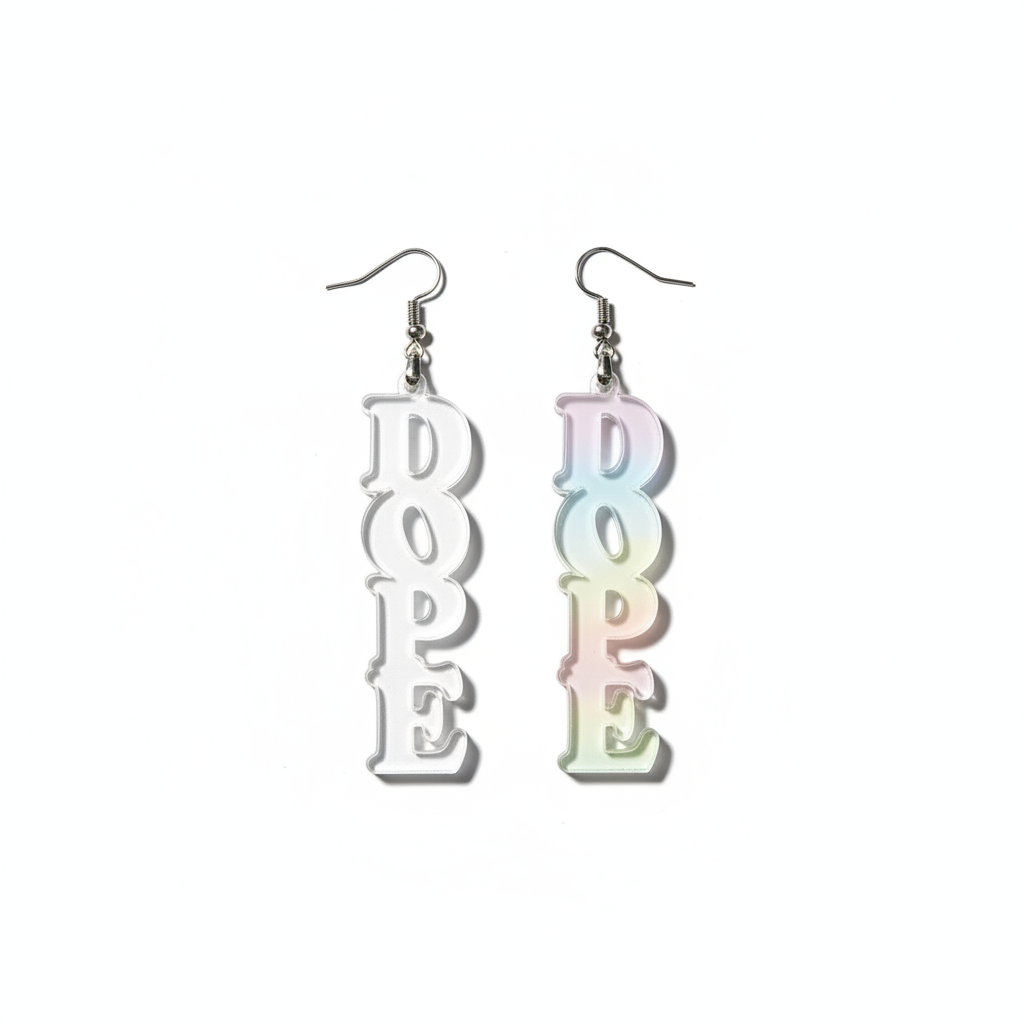 Clear 'DOPE' earrings held by a hand with a neutral background