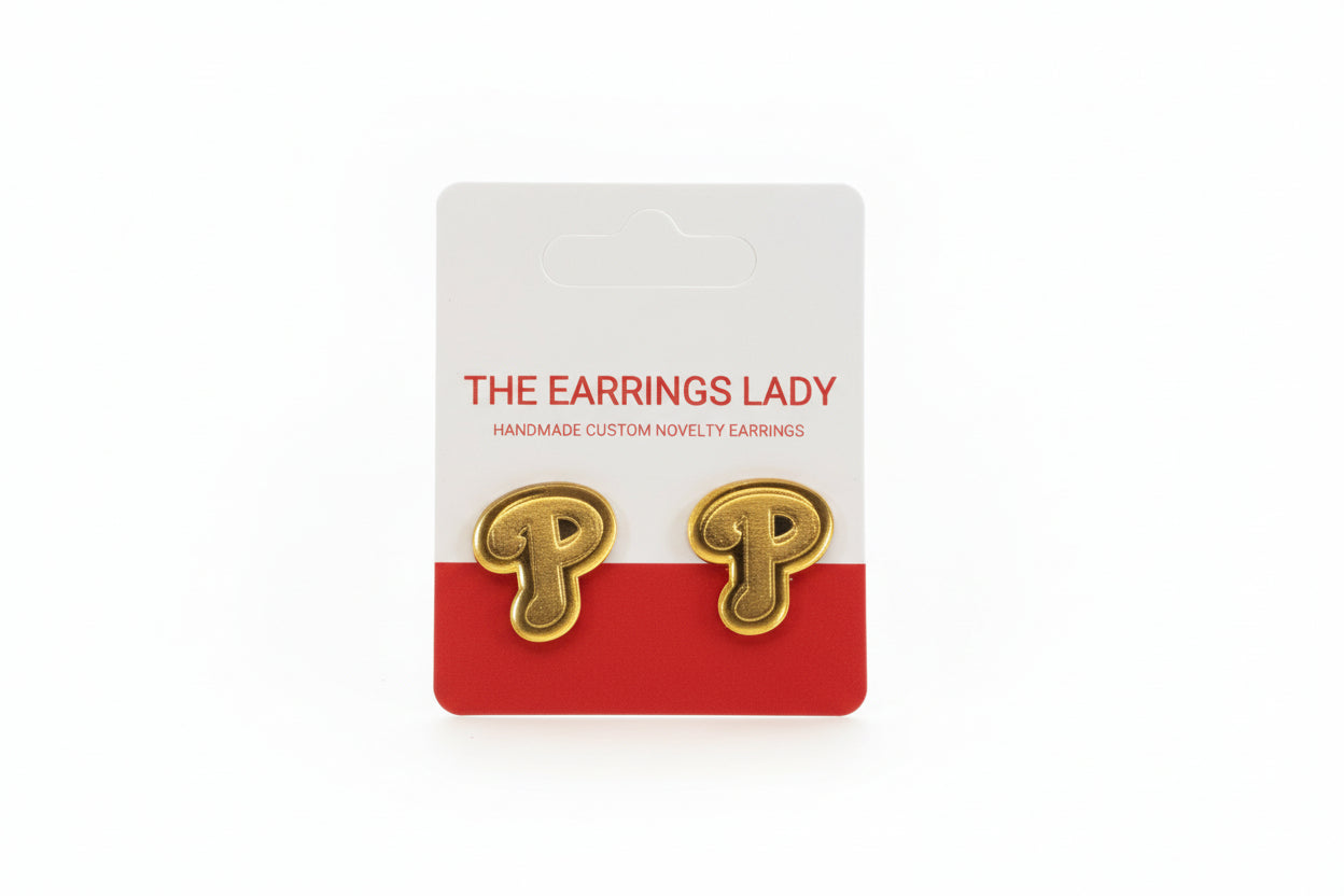 Gold letter 'P' earrings on a branded card with 'The Earrings Lady' text.