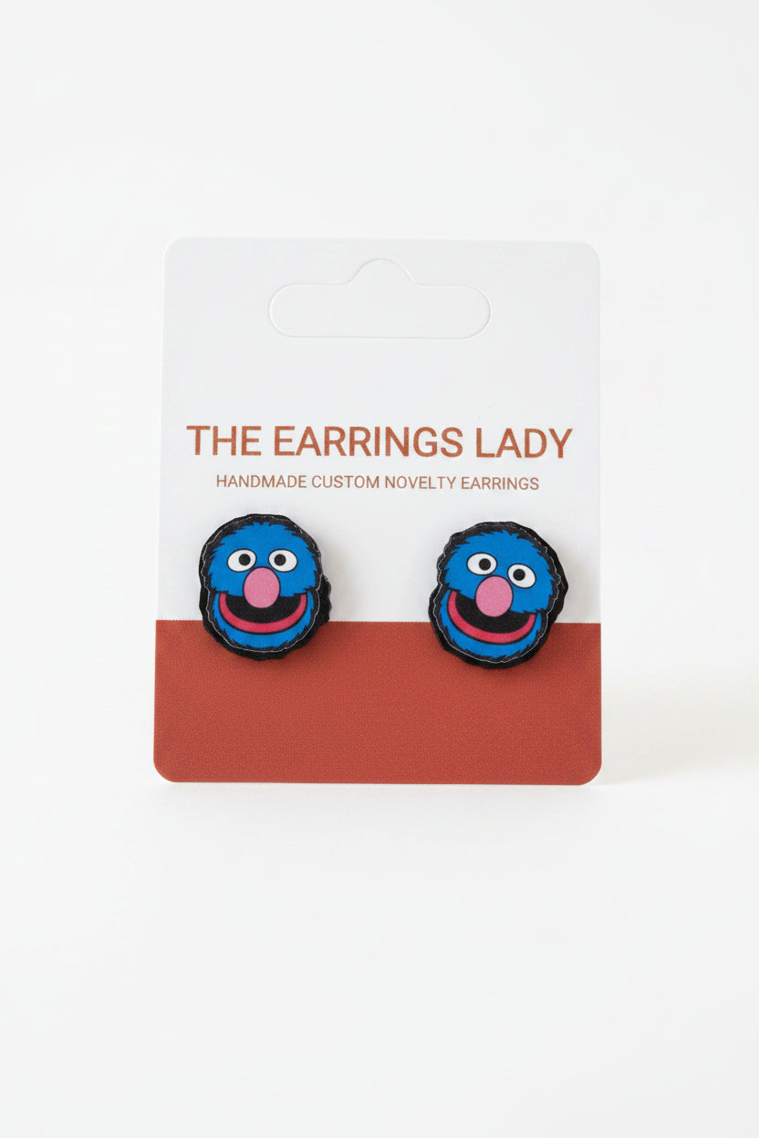 Blue novelty earrings on a card labeled 'The Earrings Lady'.