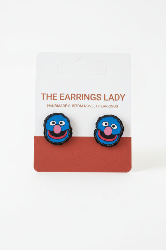Blue novelty earrings on a card labeled 'The Earrings Lady'.