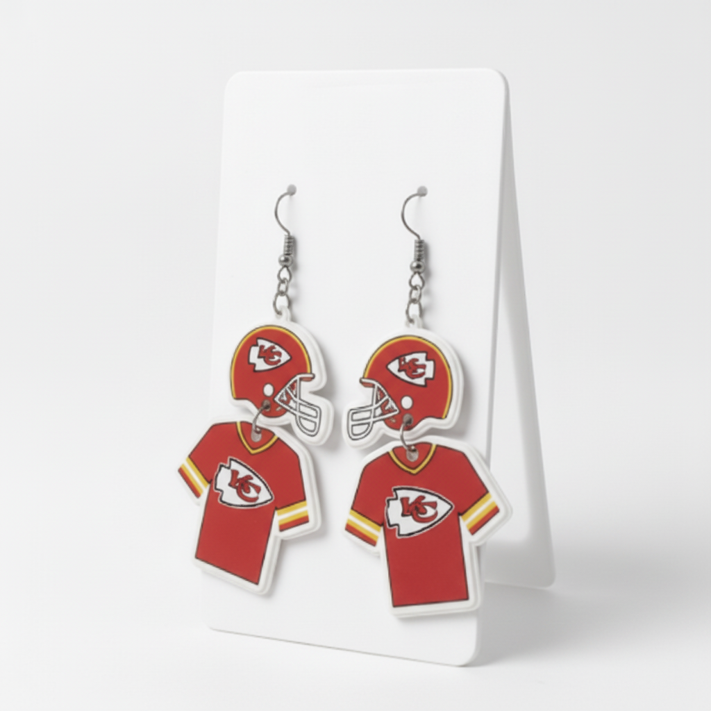 Pair of earrings shaped like Kansas City Chiefs jerseys on a white card.