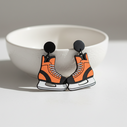 Orange and black laser cut hockey earrings.