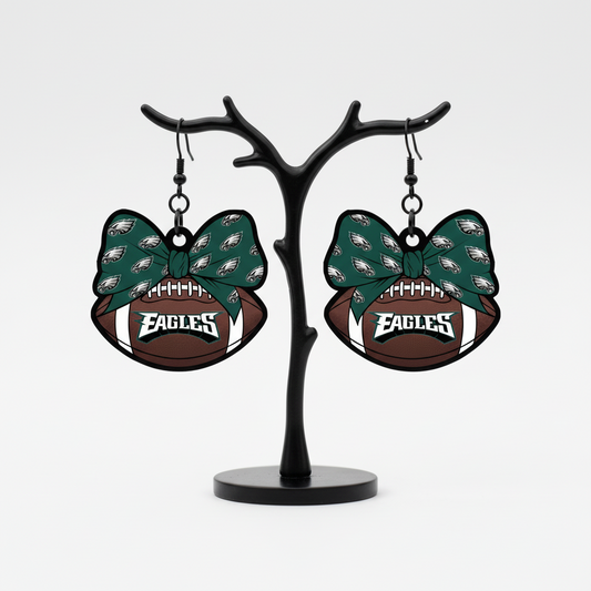 Philadelphia Eagles bow football dangle earrings.
