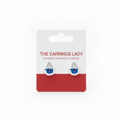 Earring card with earrings on a textured surface