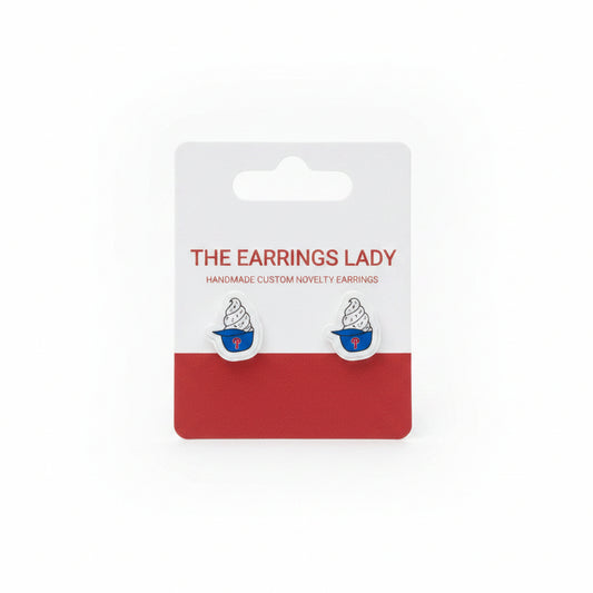 Earring card with earrings on a textured surface
