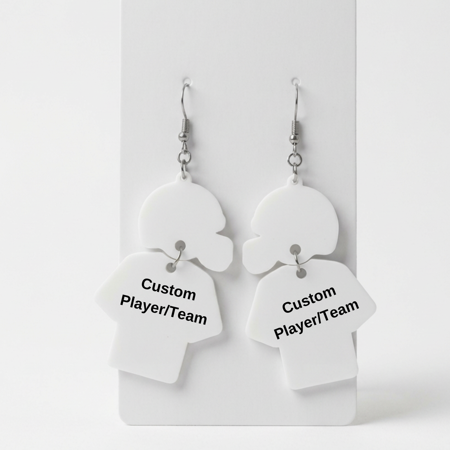 White heart-shaped earrings with 'Custom Player/Team' text on a white background