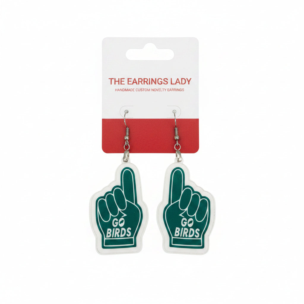 A pair oftext, displayed on a white and red card labeled 'THE EARRINGS LADY' against a gray background.