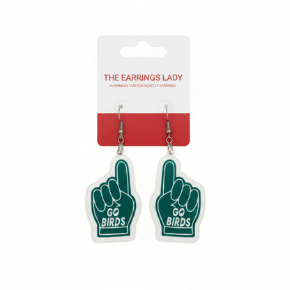 A pair oftext, displayed on a white and red card labeled 'THE EARRINGS LADY' against a gray background.